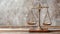 Vintage balance scales of justice on wooden table against a blurred background, judicial system concept