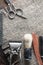 Vintage barber tools dangerous razor, hairdressing scissors, old manual clipper, metal comb, shaving brush. Lies on a rough burlap