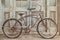 Vintage beach cruiser in front of antique wooden doors