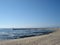 Vintage beach with lighthouse and fishermans boats