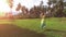 Vintage beautiful romantic blonde bride running in rye field, forest in background