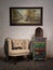 Vintage beige armchair, colorful cupboard, old radio and hanged