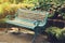 Vintage Bench in flower garden with vintage light filter