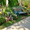 Vintage bench in flowers garden