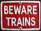 Vintage beware trains enamel sign