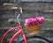 Vintage bicycle with basket with peony flowers