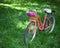 Vintage bicycle with basket with peony flowers