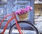 Vintage bicycle with basket with peony flowers