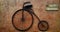 Vintage bicycle hanging on brown rough wall. Retro object