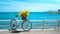 Vintage Bicycle with Yellow Flowers by the Sea. Serene Coastal Scene with Blue Skies. Perfect for Postcards and Summer