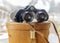 Vintage binoculars sitting on top of leather case