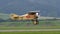 Vintage biplane of First World War WWI in grey heavy rain cloudy sky. Copy space