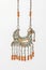 Vintage, bird-shaped pendant with precious stones isolated on the white background