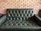 Vintage black leather texture sofa background.