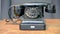 Vintage black phone with alphabet numbers, retro technology diversity,