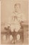 Vintage black and white photo of a young boy in sailor outfit 1900s