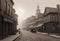 Vintage black and white (sepia) photograph of the old town of the 19th century with fog and smoke