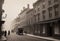 Vintage black and white (sepia) photograph of the old town of the 19th century with fog and smoke