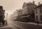 Vintage black and white (sepia) photograph of the old town of the 19th century with fog and smoke