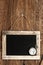 Vintage blackboard hanging on wooden wall