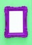 Vintage blank ultra violet photo frame over green background. Ready for photography montage. Top view from above.