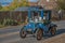 A vintage Blue car taking part in the London-Brighton Rally going through Burgess Hill, Sussex,England