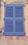 Vintage blue close window with shutters