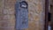 Vintage blue-grey ceramic mailbox with letter on old stone terracotta wall