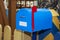 Vintage blue mail box with red raised flag