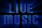 Vintage blue metallic live music word text with light reflex and