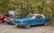 Vintage blue muscle car Ford Mustang coupe at a car show parked