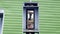 Vintage Blue outdoors public payphone booth on pole