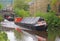 vintage boats traveling to the historic narrow boat club gathering held on the may bank holiday on the rochdale canal at hebden