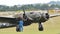 Vintage bomber plane turns on the propeller motors during historical reenactment