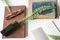 vintage books with ink pot, goose feather glasses and twig, on white desk