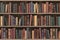 Vintage books on old wooden shelf. Old library or antique bookshop. Tiled seamless texture, wallpaper or background. 3d