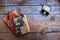 Vintage books and retro jewelry on wooden table