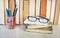 Vintage books, spectacles and pens,