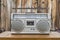 Vintage Boombox on Table with Rustic Cabin Wall