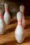 Vintage bowling pins set up in bowling alley.