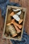 Vintage box with bobbins, reels, spools, threads and lace
