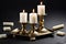 Vintage brass candlesticks with burning candles and small candles lying on the table on a black background. photo