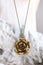 Vintage brass jewelry necklace in the form of a flower