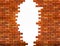 Vintage brick wall background with hole.