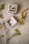 Vintage bridal ring of red gold in a gray jewelry box against the grey background of calligraphy and flowering twigs