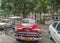 A vintage bright red car parked in Havana Cuba