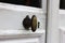 Vintage bronze door handle on white door