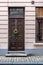 Vintage brown front door decorated with Christmas wreath