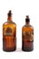 Vintage Brown Poison Bottles on White Background