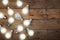 Vintage bulbs on wooden background - idea, innovation, teamwork and leadership concept. Space for text